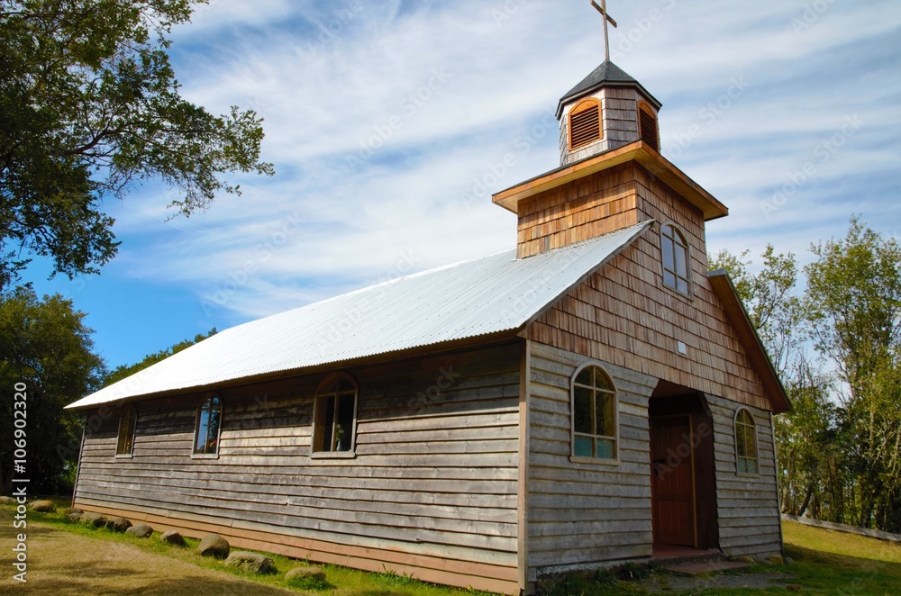 An old wooden church on the small island Aucar close to Quemchi on the island Chiloé in Chile An old wooden church on the small island Aucar close to Quemchi on the island Chiloé in Chile