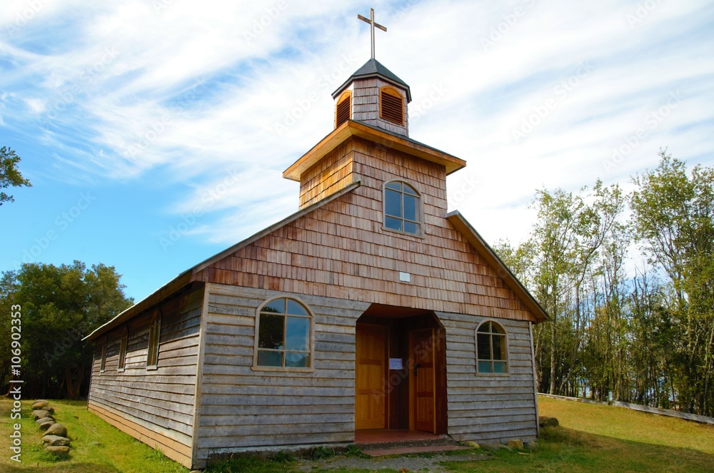 An old wooden church on the small island Aucar close to Quemchi on the island Chiloé in Chile An old wooden church on the small island Aucar close to Quemchi on the island Chiloé in Chile