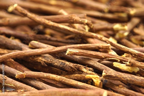 Liquorice root lying on a white background