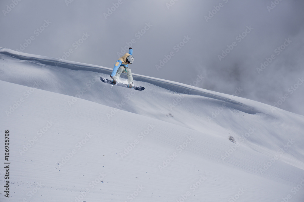 Snowboarder jumping on mountains. Extreme sport. Snowboarder jumping on mountains. Extreme sport.