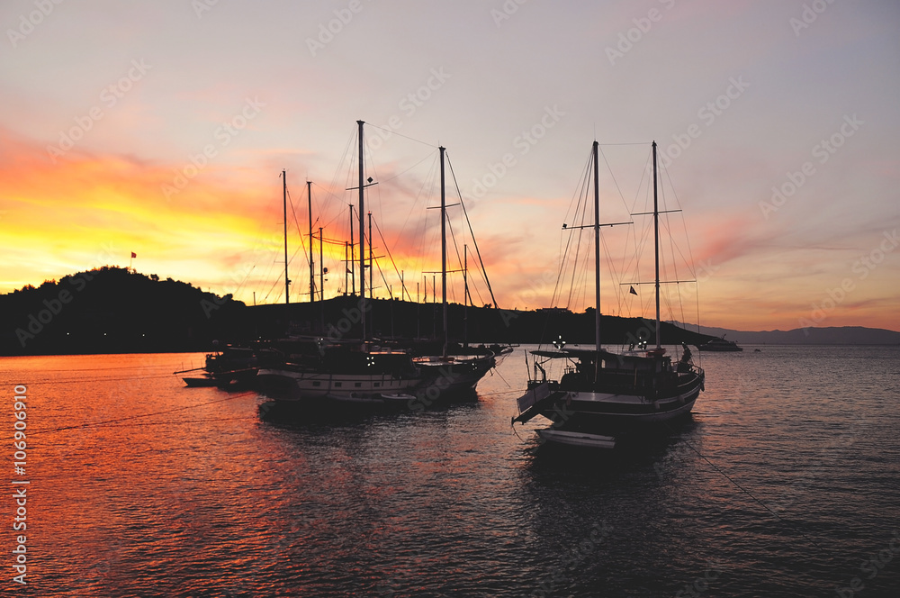 Yachts on the water during colorful sunset