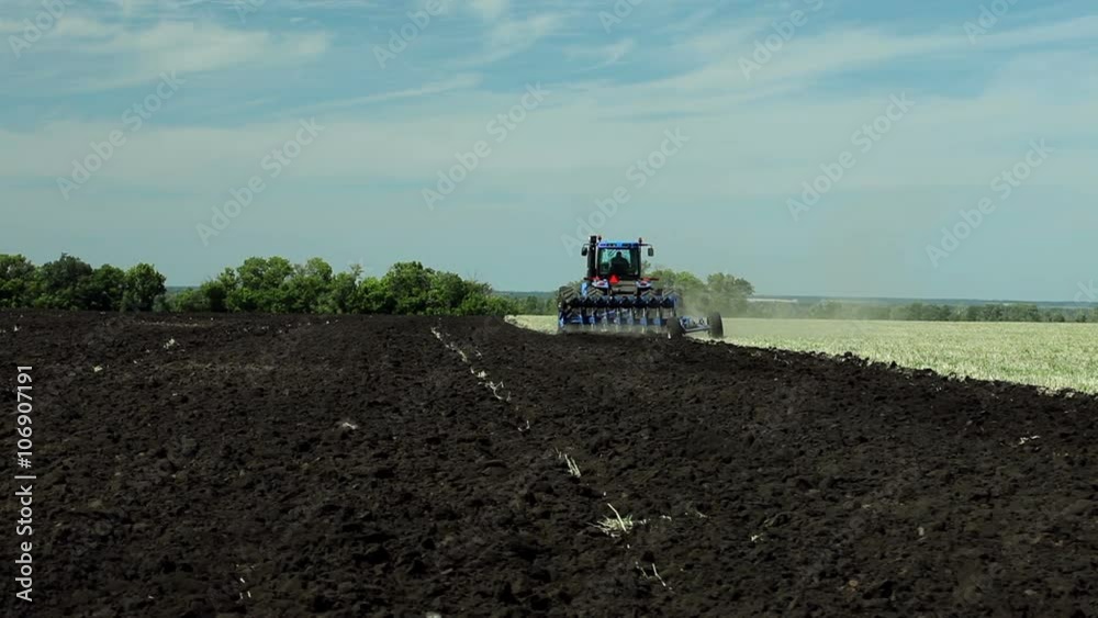 Land cultivation. Tractor prepares land for sowing. Land cultivation. Tractor prepares land for sowing.