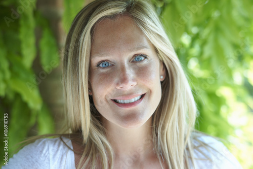 Portrait of mature woman with blonde hair and blue eyes