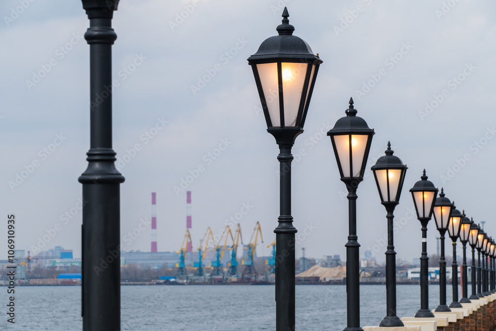 Lanterns along the promenade during the day