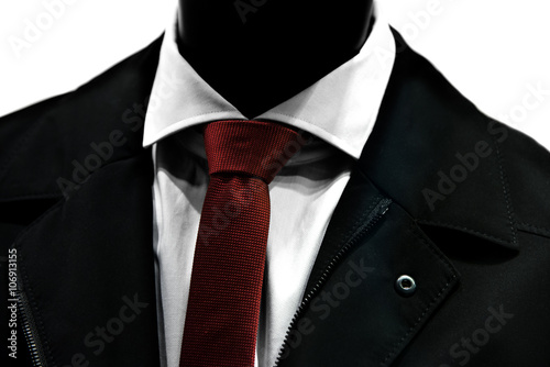 Close up of red tie over elegant suit.