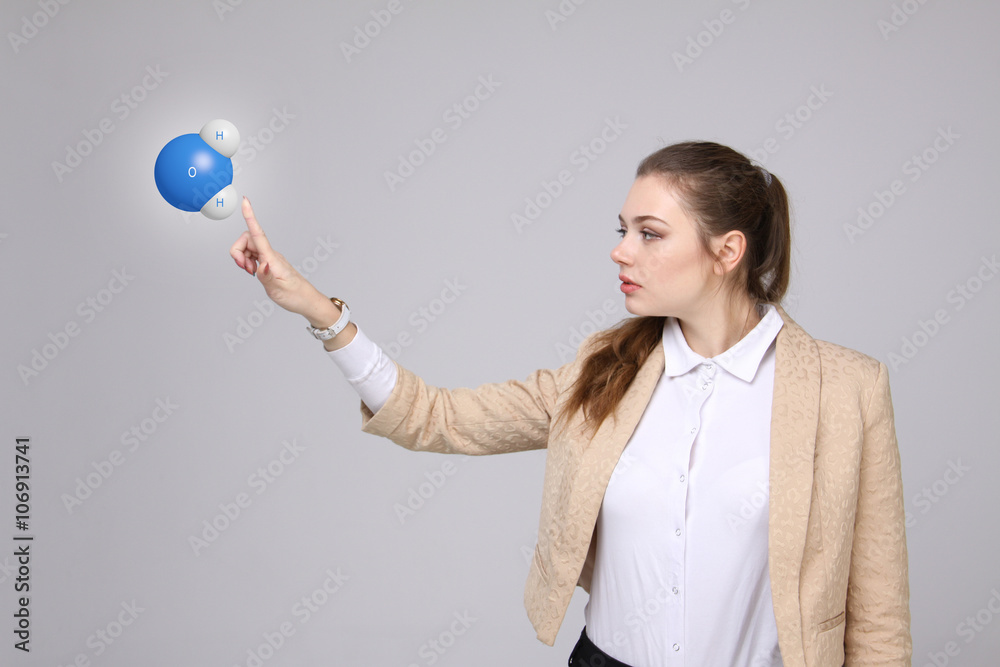 Young woman scientist with model of water molecule. Young woman scientist with model of water molecule.