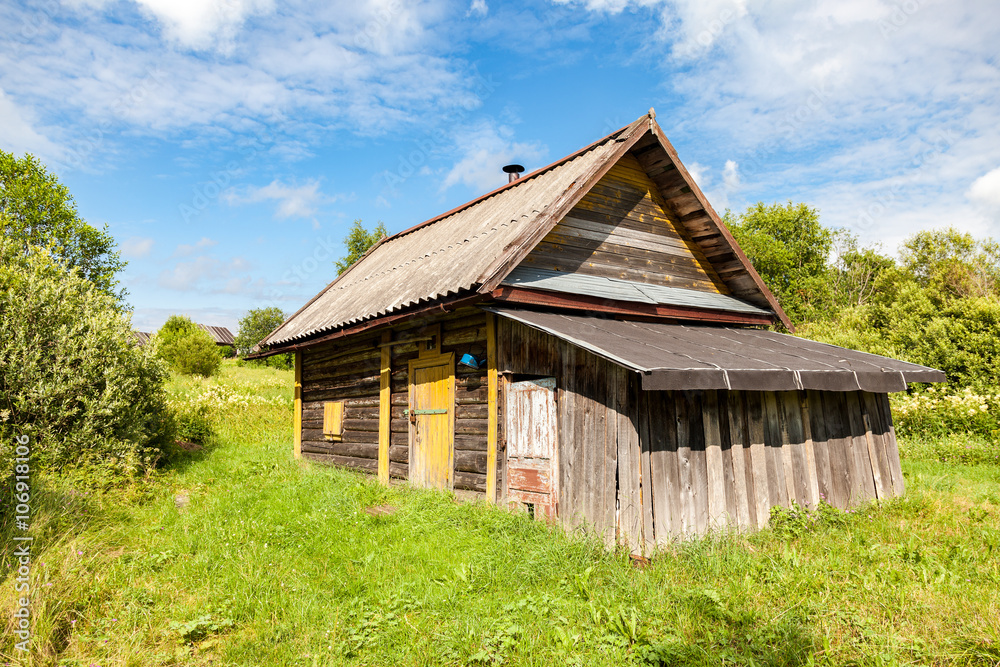 Traditional russian wooden bath at the countryside in summer sun Traditional russian wooden bath at the countryside in summer sun