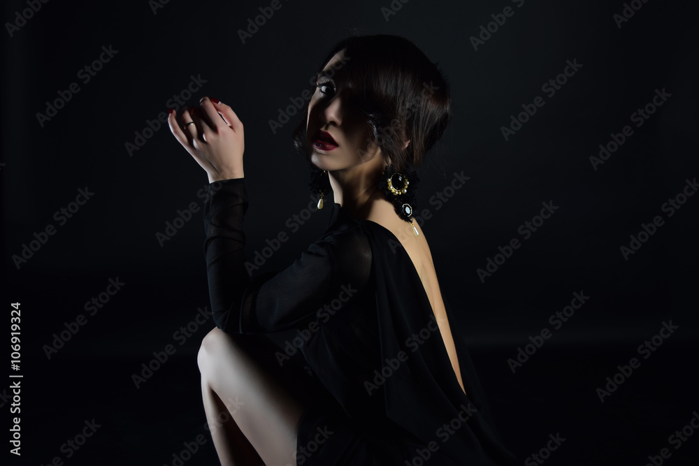 Portrait of a beautiful mysterious woman, red lipstick and collar with beads Portrait of a beautiful mysterious woman, red lipstick and collar with beads