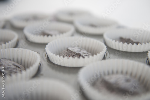 Close up of cup cake mixture in cake cases photo