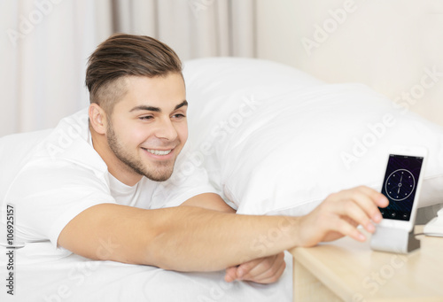 Beautiful young man waking ...