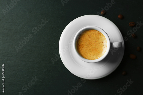 Cup of coffee on gray background