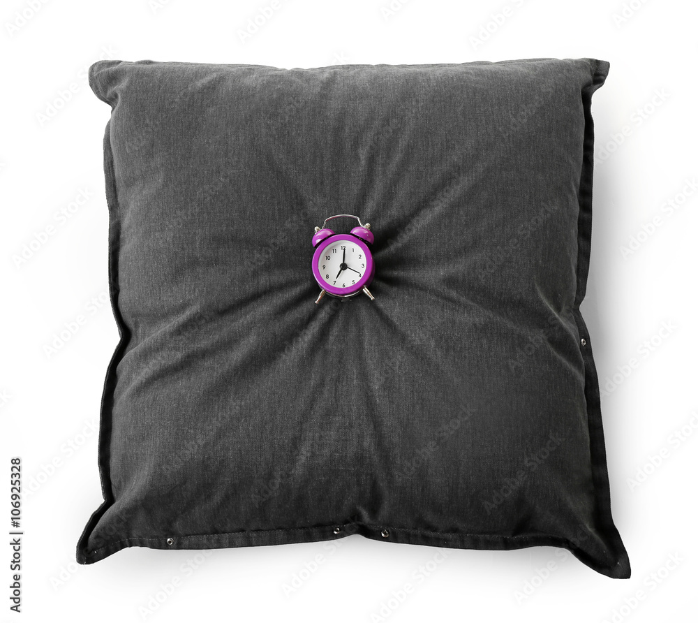 Alarm clock on pillow, isolated on white Alarm clock on pillow, isolated on white