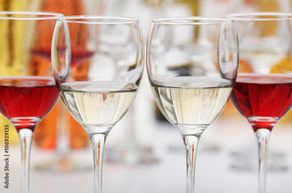 Wine glasses with red and white wine, closeup Wine glasses with red and white wine, closeup