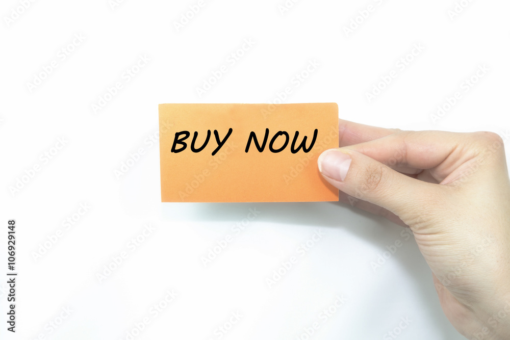 hand holding orange card written buy now over isolated hand holding orange card written buy now over isolated