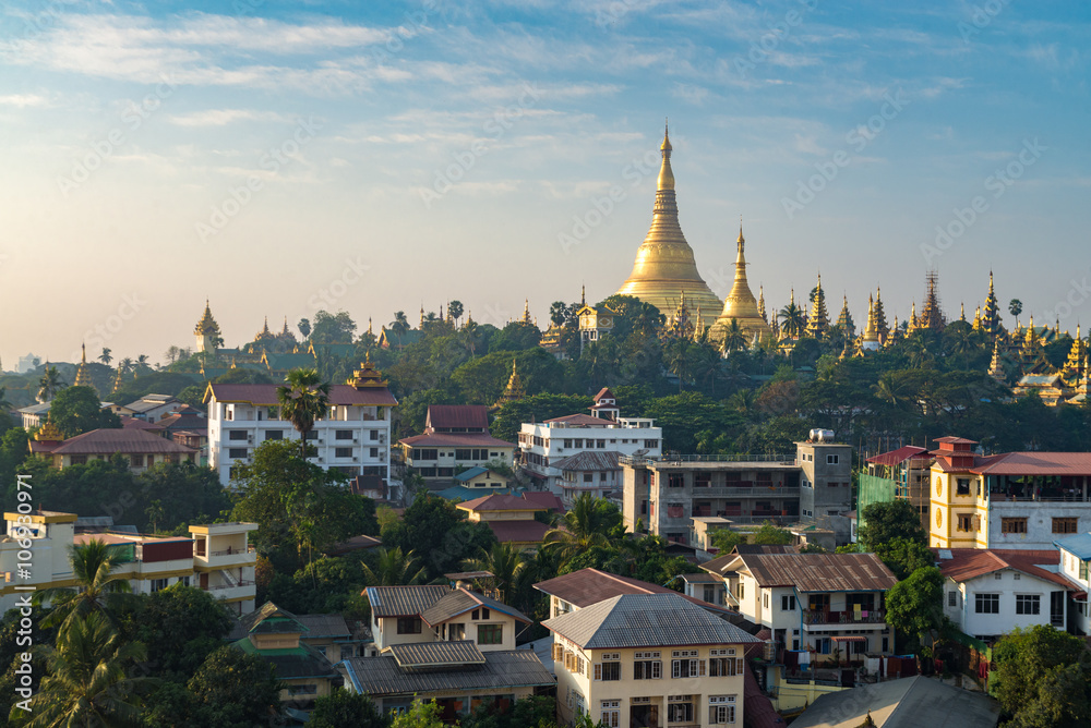 Shwedagon pagoda with Yangong cityscape foreground in shiny day Myanmar.