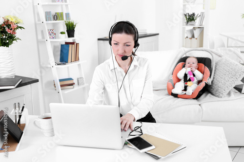 Businesswoman with baby boy...