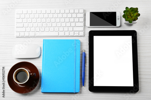 Business desk with equipment, flat lay