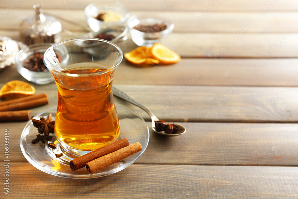 Glass cup of tea on wooden background Glass cup of tea on wooden background