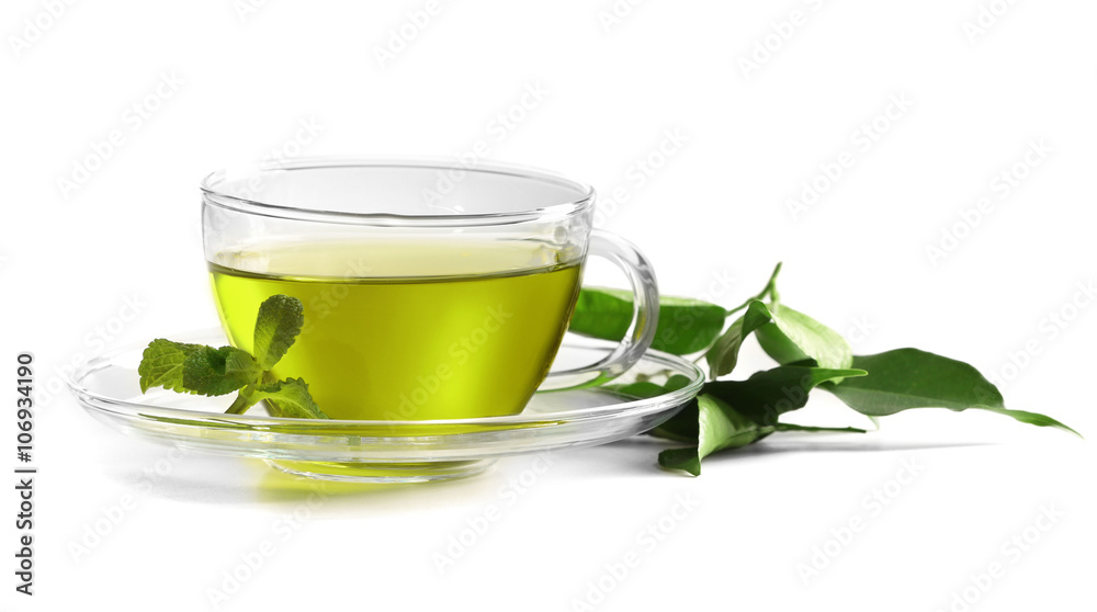 Cup of tea and tea leaves isolated on white