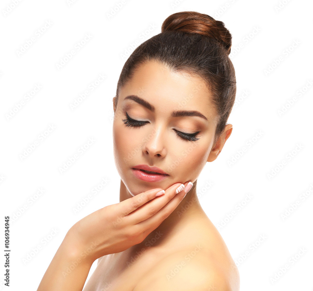 Beautiful young girl with closed eyes holding hand near face, isolated on white Beautiful young girl with closed eyes holding hand near face, isolated on white