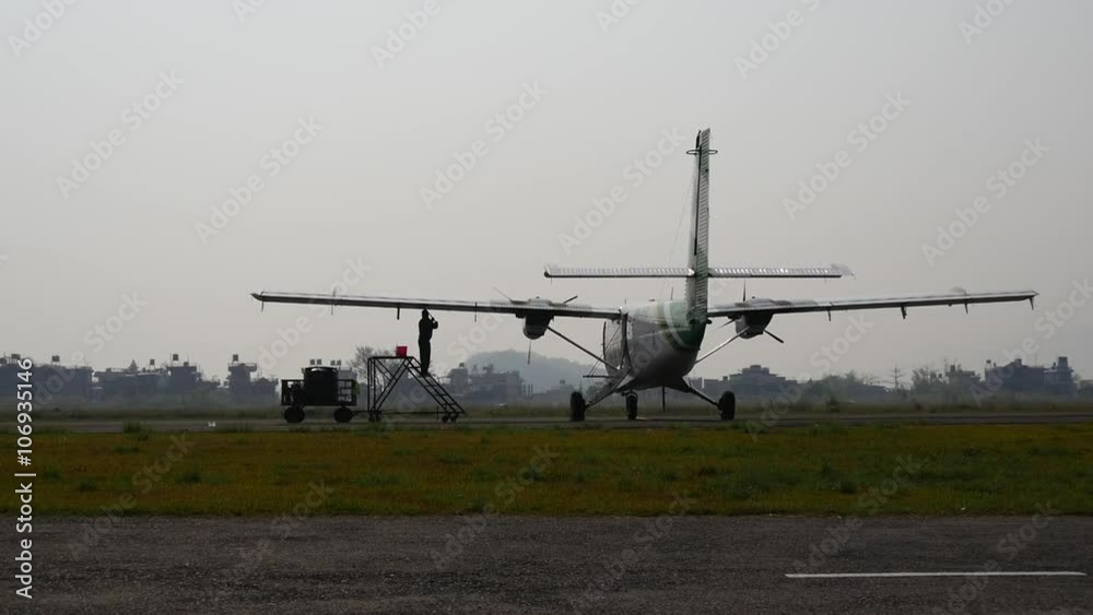 Technical staff washes plane