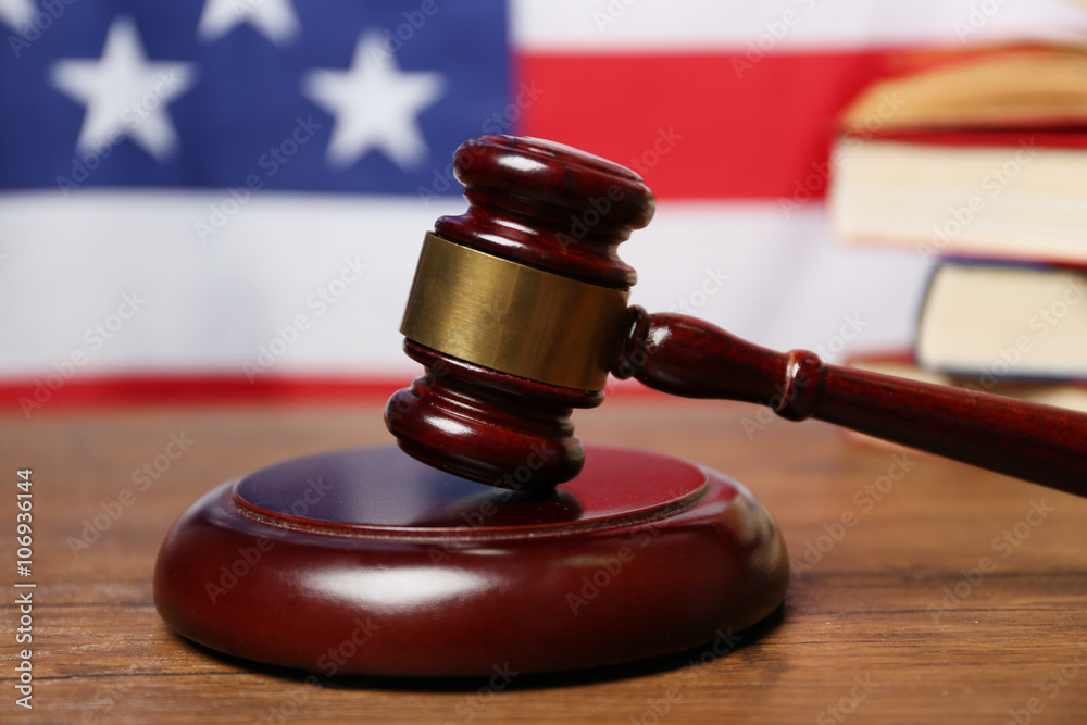Judge gavel on American flag background Judge gavel on American flag background