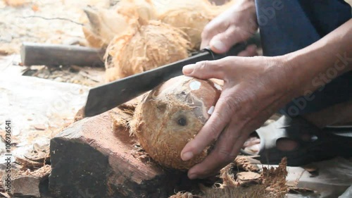 Peeling coconuts 