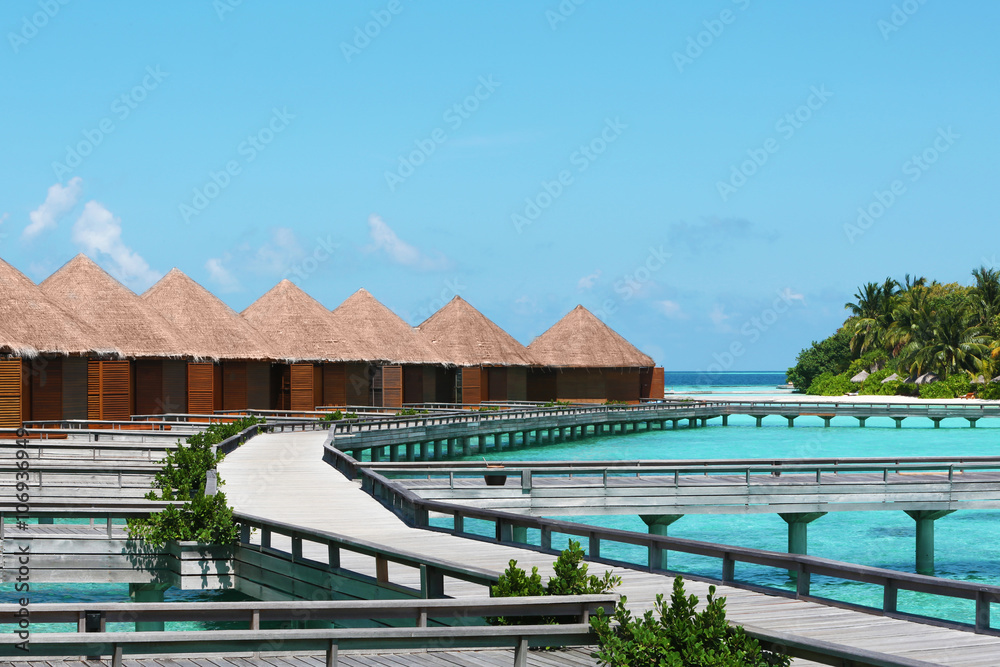 Fototapeta premium Water villas above blue ocean in Baros Maldives