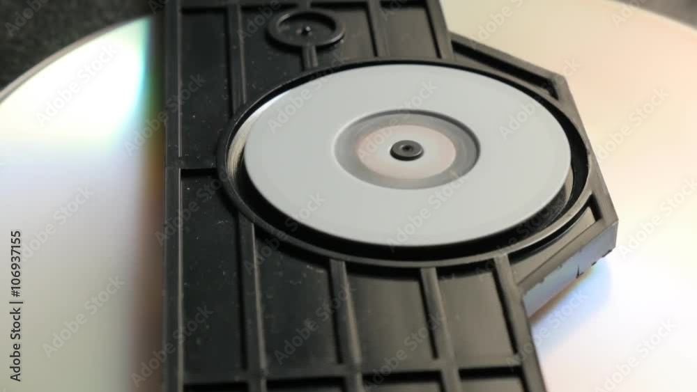 Reading sequence of CD disk in player mechanism 4K 2160p UltraHD footage - DVD disc in players mechanism rotating fast 4K 3840X2160 UHD video Reading sequence of CD disk in player mechanism 4K 2160p UltraHD footage - DVD disc in players mechanism rotating fast 4K 3840X2160 UHD video