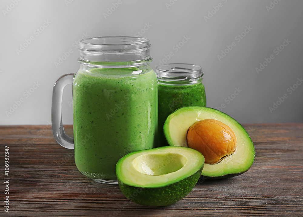 Avocado cocktail on table in front of grey background Avocado cocktail on table in front of grey background