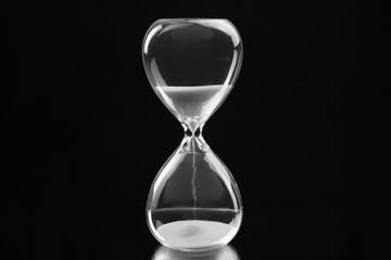 Hourglass on black background
