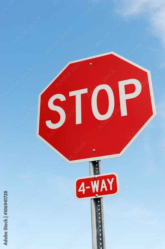 stop sign against blue sky