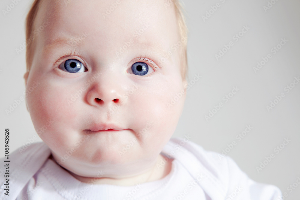 Close up of baby girl biting lip Close up of baby girl biting lip
