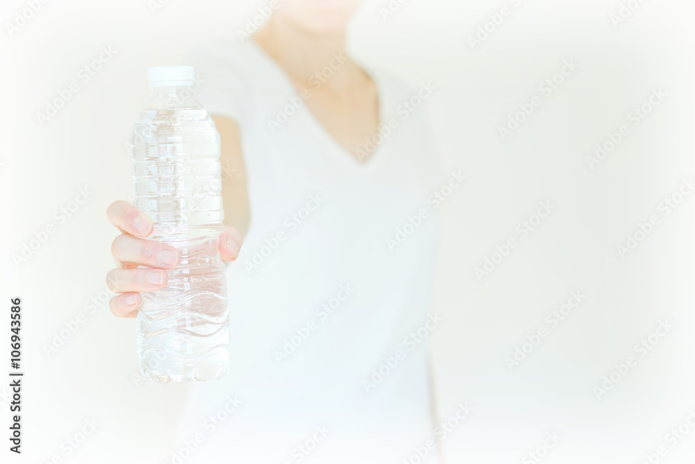 young woman show bottle of water . isolated