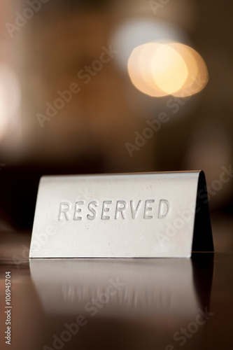 Reserved notice on restaurant table photo