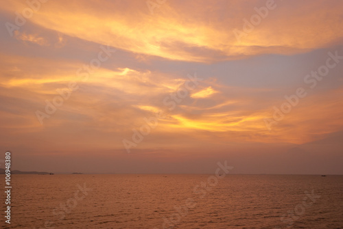 sky at sunset with ocean as background