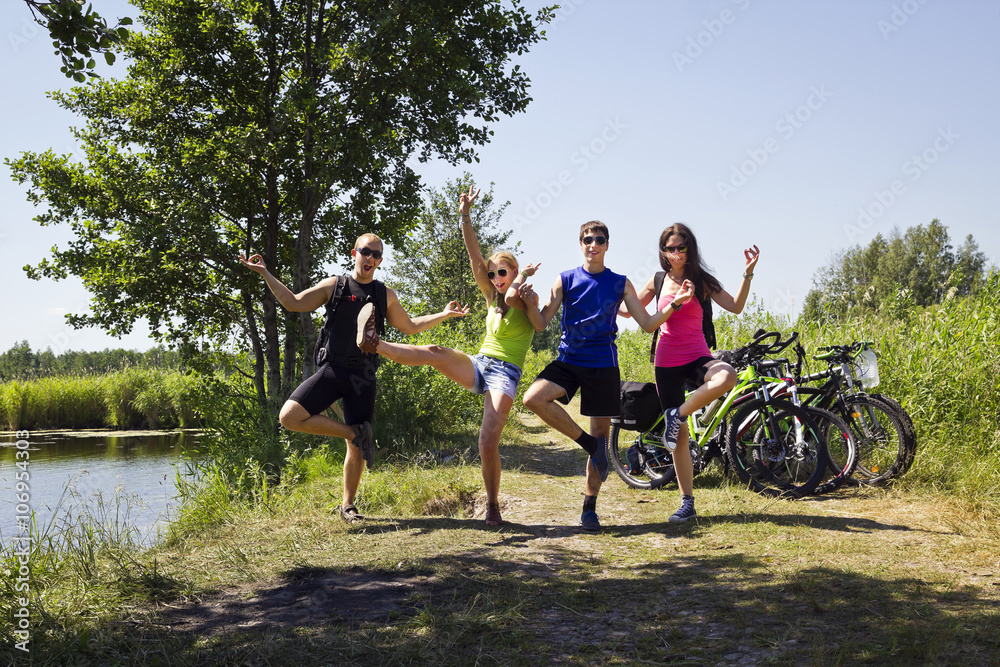 Obraz premium young friends on bike touring