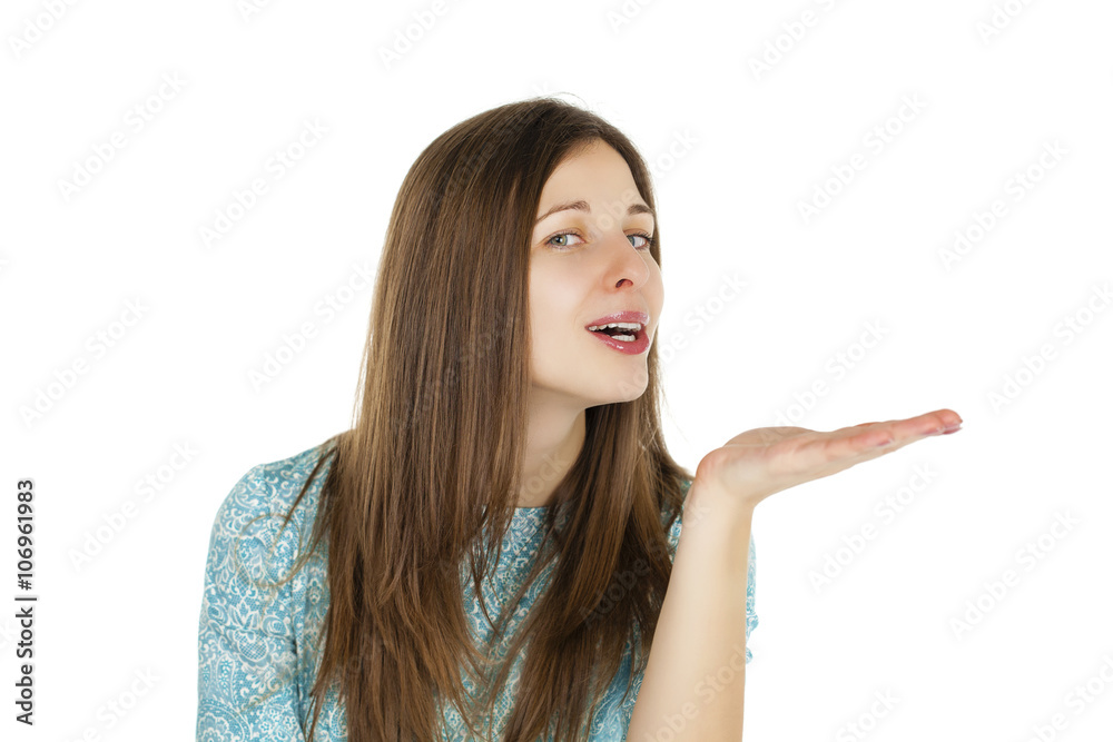 Young brunette woman blowing while sending an air kiss Young brunette woman blowing while sending an air kiss