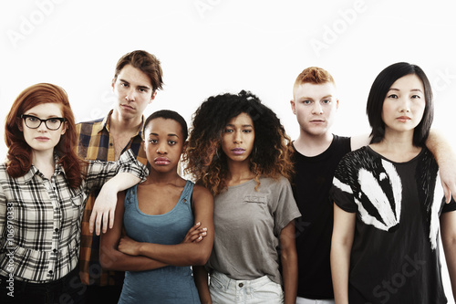 Formal studio portrait of six serious young adults