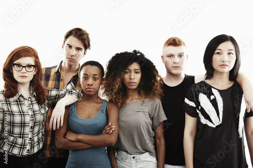 Formal studio portrait of six serious young adults photo