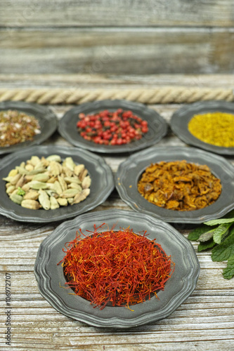  Spices and herbs in metal bowls. Food and cuisine ingredients.