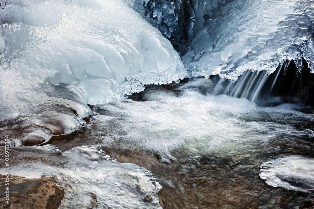 Frozen creek on winter