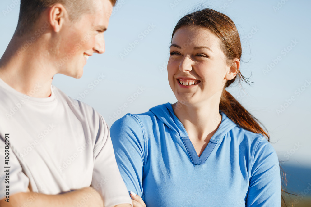 Young couple on beach training together Young couple on beach training together