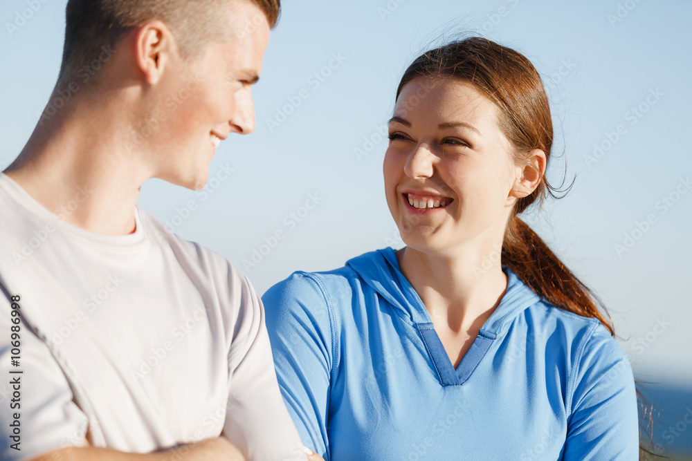 Fototapeta premium Young couple on beach training together