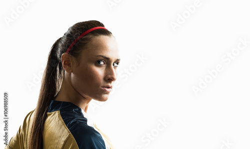 Studio portrait of young female soccer player