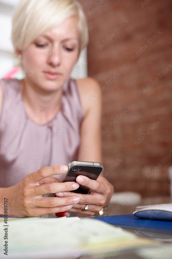 Mid adult woman using smartphone Mid adult woman using smartphone