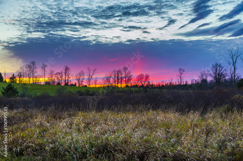 colorful rural sunset scene in late autumn