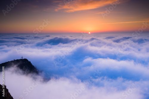 sunrise in the sea of clouds