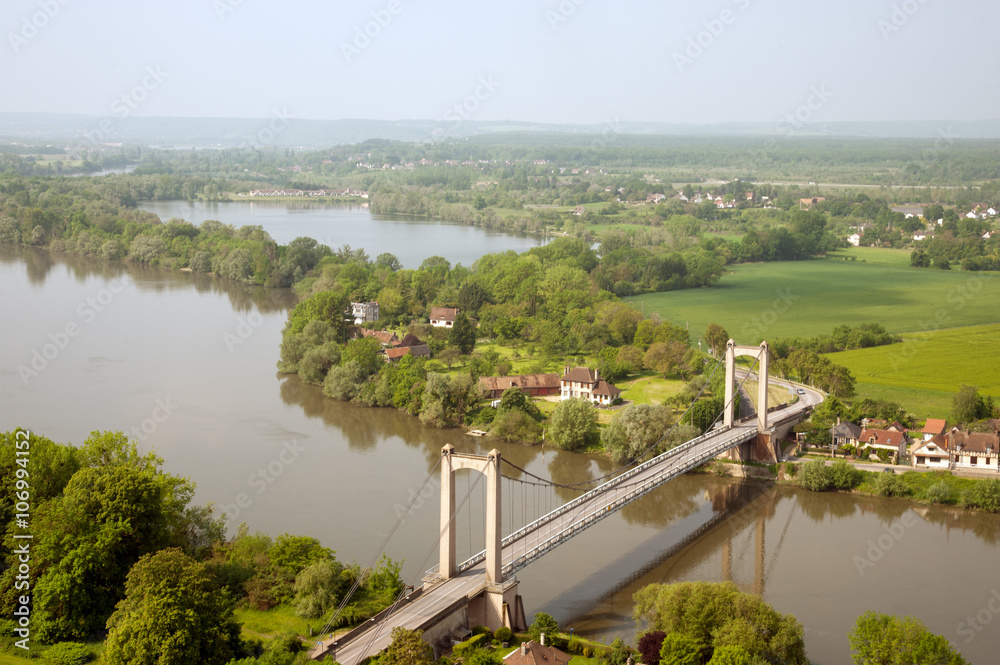 Les Andelys Suspension Bridge across Seine river in Normandy, France Les Andelys Suspension Bridge across Seine river in Normandy, France