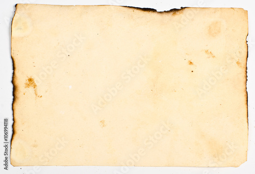 very old paper with burnt edges